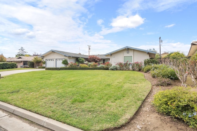 ranch-style home featuring a garage and a front lawn