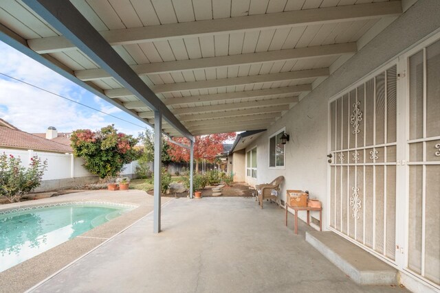 view of swimming pool with a patio area