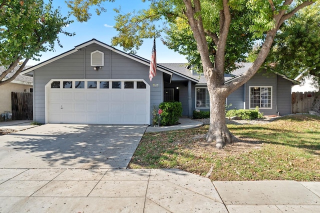 single story home featuring a garage