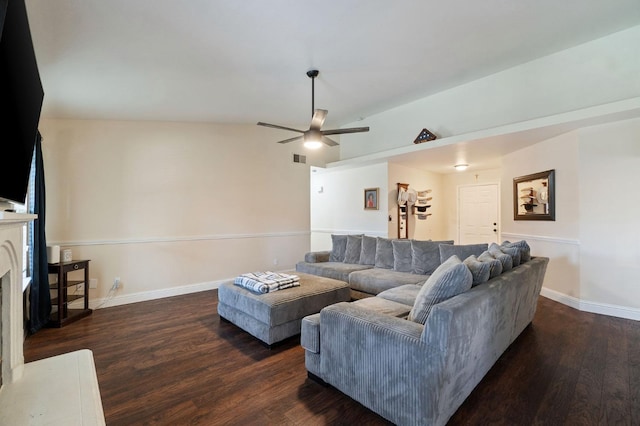 living room with ceiling fan, dark hardwood / wood-style flooring, and lofted ceiling