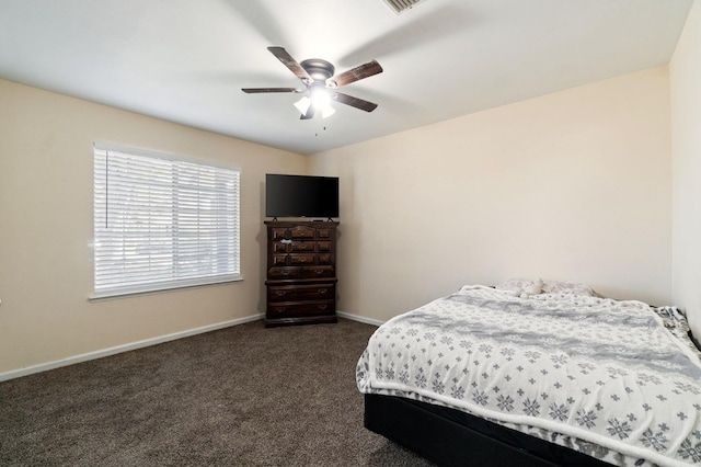 bedroom with dark colored carpet and ceiling fan