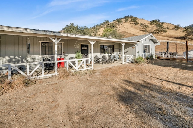 view of front facade with a mountain view and a porch