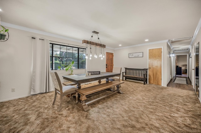 dining space with crown molding and carpet