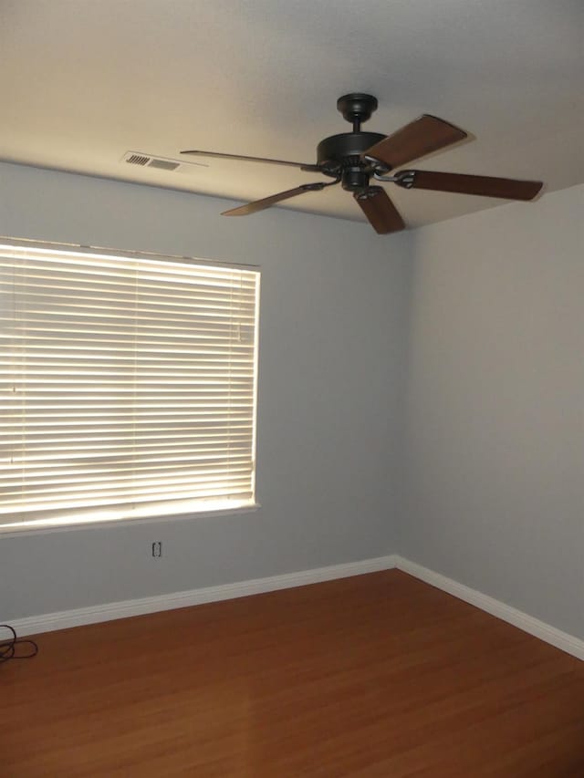 unfurnished room featuring wood-type flooring and ceiling fan