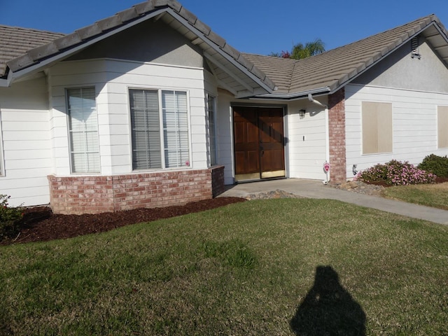 exterior space with a lawn