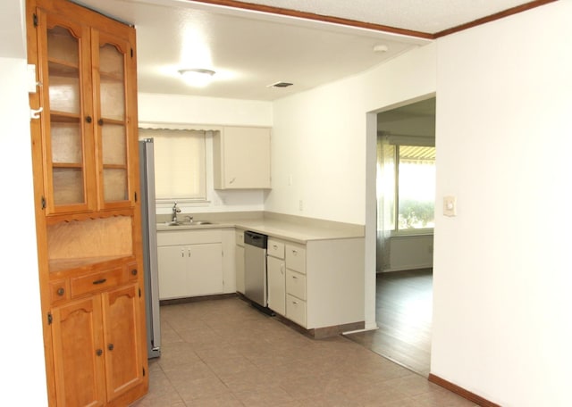 kitchen featuring dishwasher, light wood-type flooring, white cabinetry, and sink