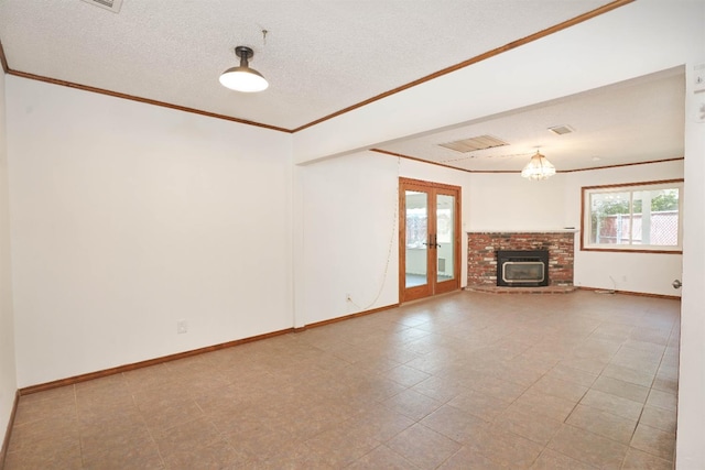 unfurnished living room with french doors, a textured ceiling, and crown molding