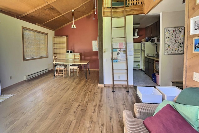 living room featuring lofted ceiling, light hardwood / wood-style floors, and a baseboard heating unit