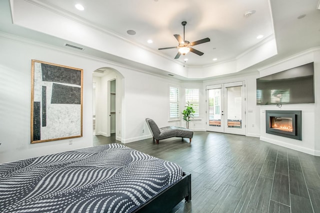 bedroom featuring access to outside, crown molding, dark hardwood / wood-style flooring, and ceiling fan