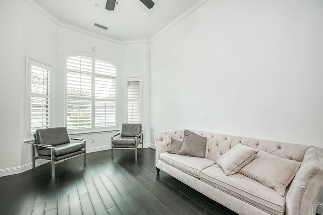 living room with dark hardwood / wood-style flooring, crown molding, plenty of natural light, and ceiling fan