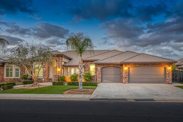 mediterranean / spanish-style home featuring a garage