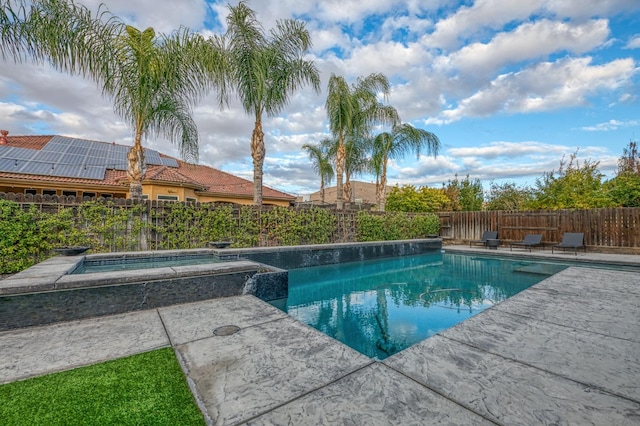 view of pool with an in ground hot tub