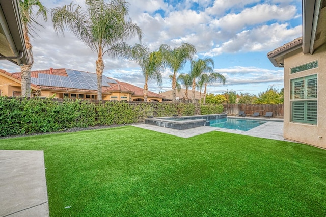 view of yard with a patio and a pool with hot tub