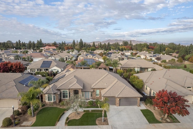 birds eye view of property with a mountain view