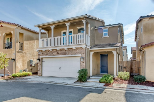 view of front of property with a garage and a balcony