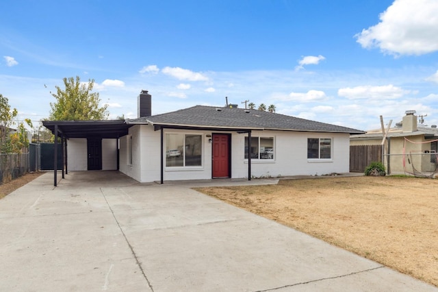 single story home featuring a carport