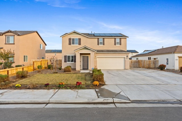 front of property with a garage and solar panels