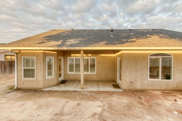 back of property with a patio area