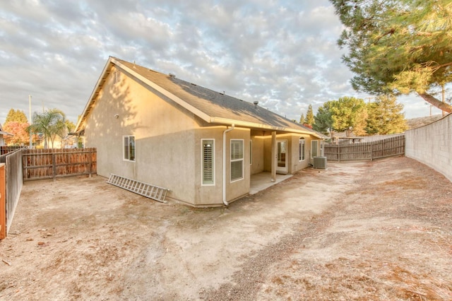 view of side of home featuring cooling unit