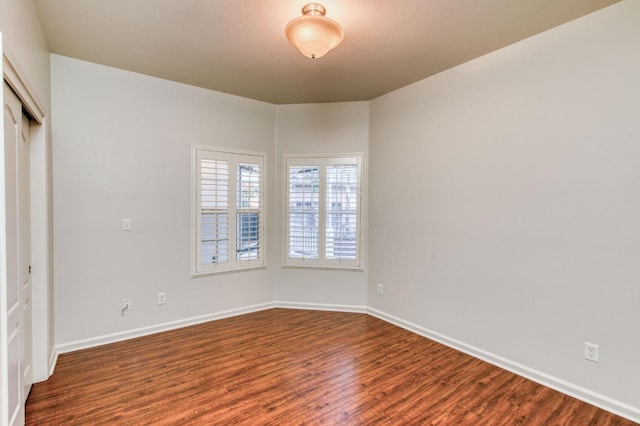 spare room with hardwood / wood-style floors