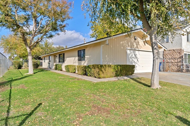 view of home's exterior featuring a garage and a yard