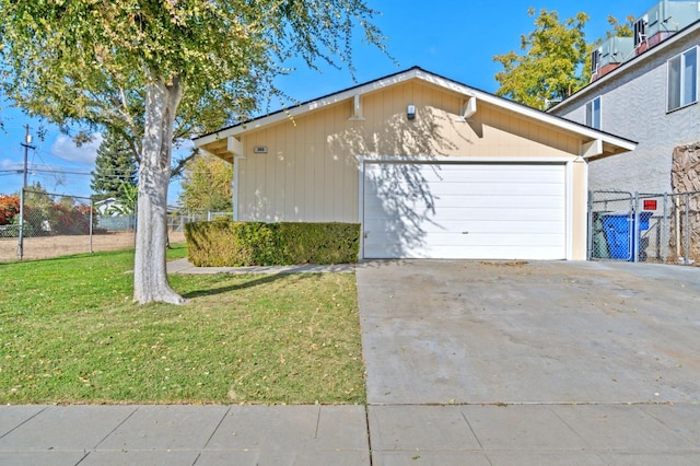 view of side of home featuring a lawn and an outbuilding