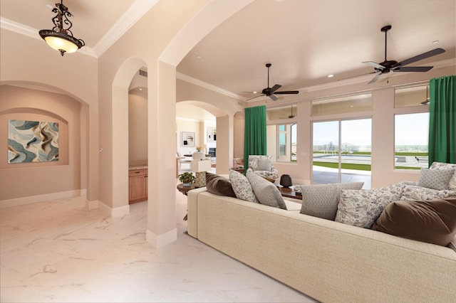 living room featuring marble finish floor, crown molding, baseboards, and ceiling fan