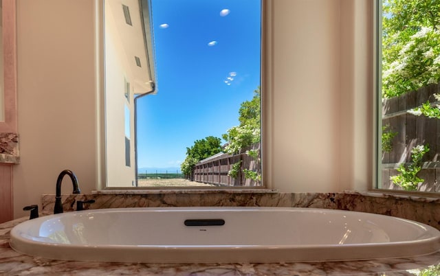 bathroom featuring a freestanding tub