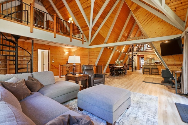 living room featuring high vaulted ceiling, beamed ceiling, wood walls, hardwood / wood-style floors, and wood ceiling