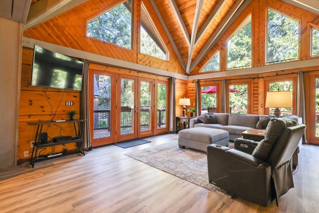 42270 Rockledge, Shaver Lake, CA 93664 - living room featuring wooden walls, high vaulted ceiling, wood finished floors, french doors, and a wooden ceiling with exposed beams