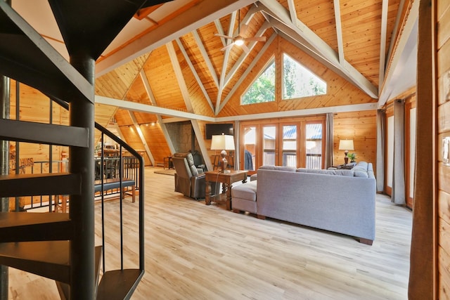 42270 Rockledge, Shaver Lake, CA 93664 - living room featuring wooden walls, high vaulted ceiling, a wood ceiling with exposed beams, wood finished floors, and french doors