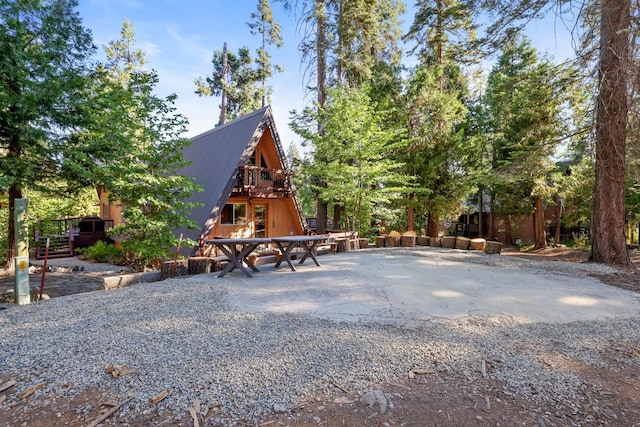 42270 Rockledge, Shaver Lake, CA 93664 - back of property with a deck, a patio area, and a metal roof