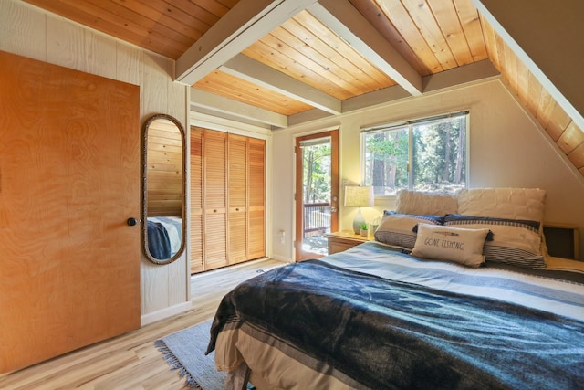 42270 Rockledge, Shaver Lake, CA 93664 - bedroom featuring wood finished floors, multiple windows, wooden ceiling, wooden walls, and a closet