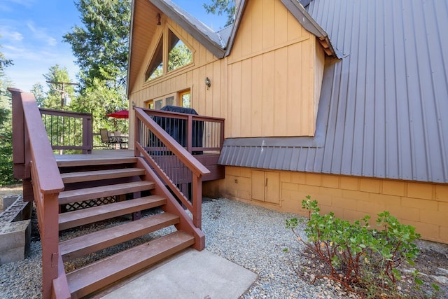 view of side of home with a deck