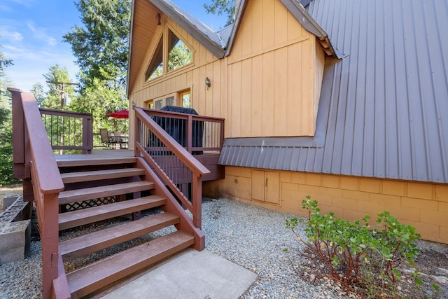 42270 Rockledge, Shaver Lake, CA 93664 - view of home's exterior featuring a deck, a metal roof, and stairs
