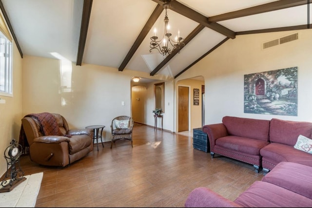 living area featuring arched walkways, vaulted ceiling with beams, visible vents, an inviting chandelier, and wood finished floors