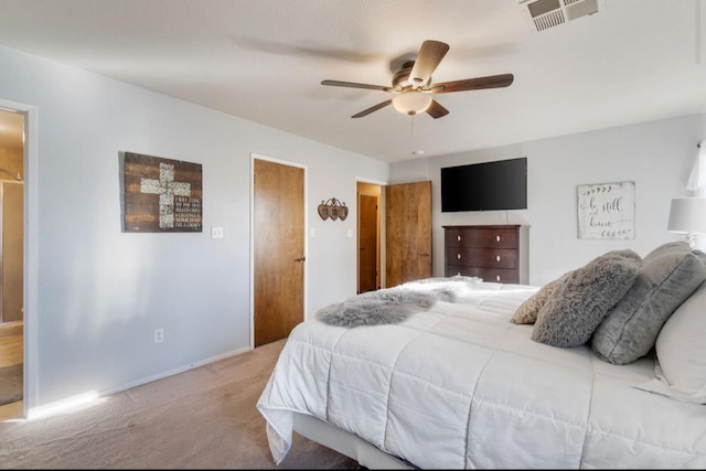 bedroom with baseboards, visible vents, a ceiling fan, and light colored carpet