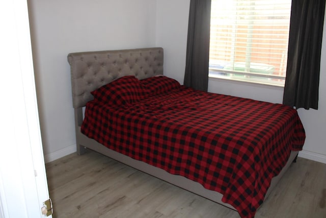 bedroom with light hardwood / wood-style flooring