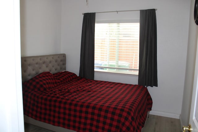 bedroom with light hardwood / wood-style floors