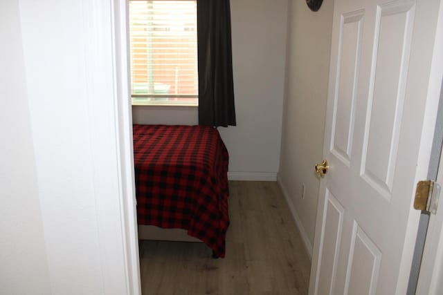 bedroom with light hardwood / wood-style floors