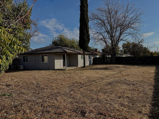 view of side of home featuring central AC