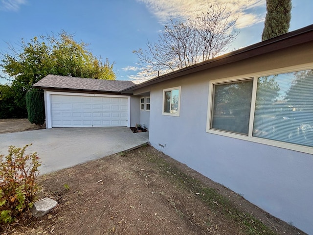 view of property exterior featuring a garage