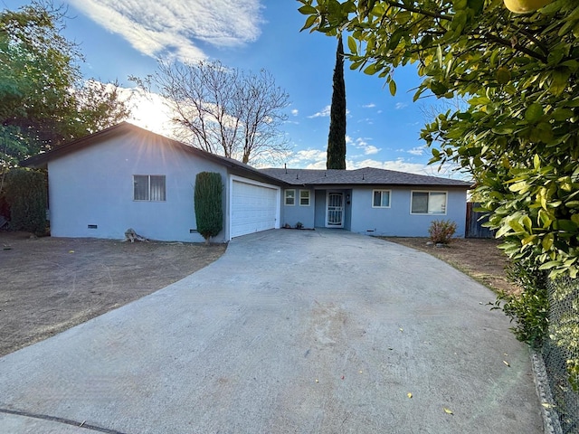 ranch-style home featuring a garage