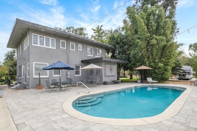 view of swimming pool with a patio area