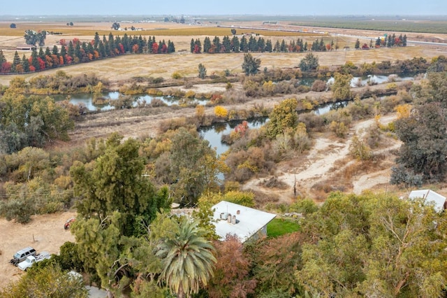 drone / aerial view with a water view and a rural view