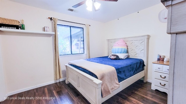 bedroom with ceiling fan and dark hardwood / wood-style flooring