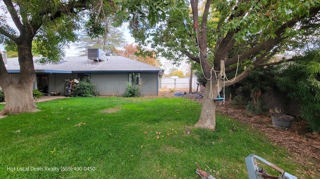 view of yard featuring central AC unit