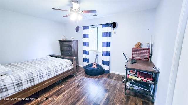 bedroom with dark hardwood / wood-style floors and ceiling fan