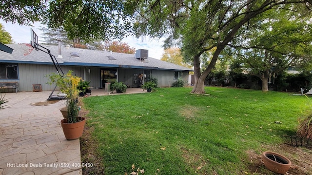 view of yard featuring a patio and central AC unit