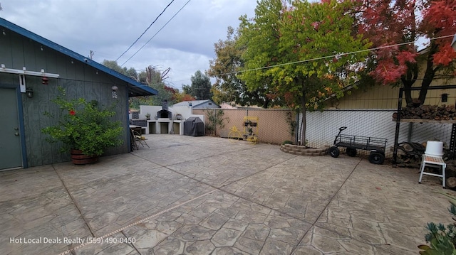 view of patio featuring a grill